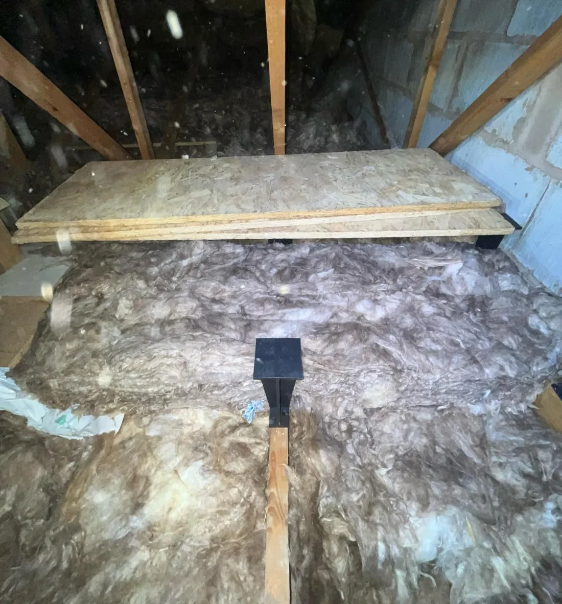 Raised loft legs set into the new insulation with boards laid across them