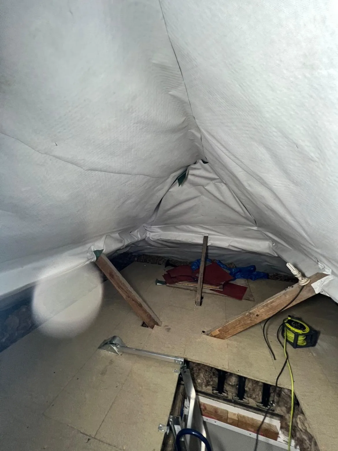 Boarded loft floor and loft hatch after loft boarding in Lancing, West Sussex