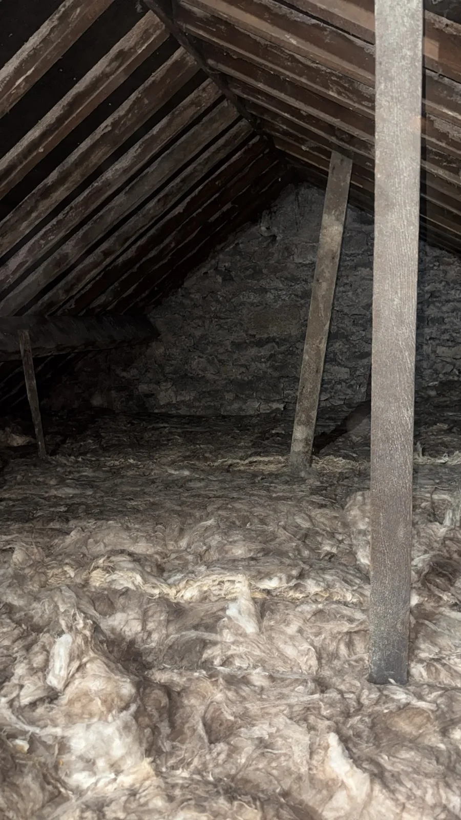 Finished Denbigh loft insulation under the roof timbers