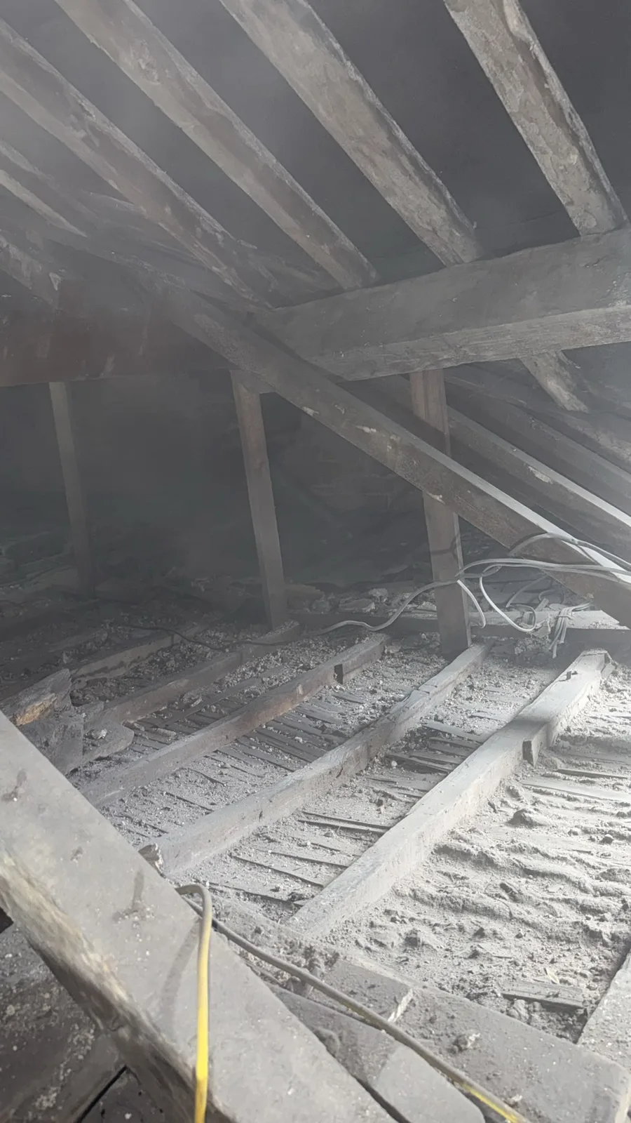Denbigh loft with old insulation removed and joist bays cleaned out