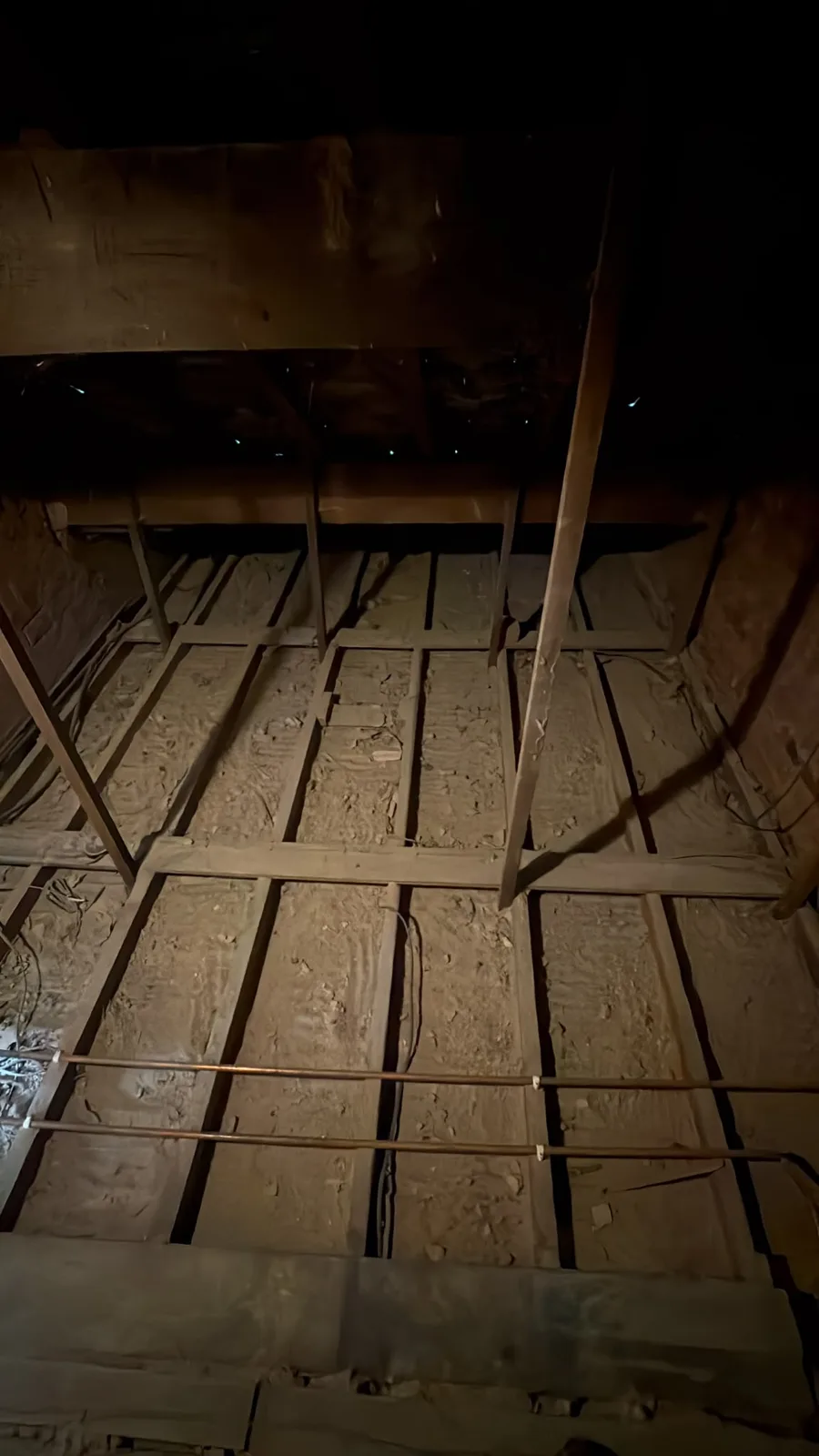 Empty joist bays in a Garstang loft ready for new loft insulation