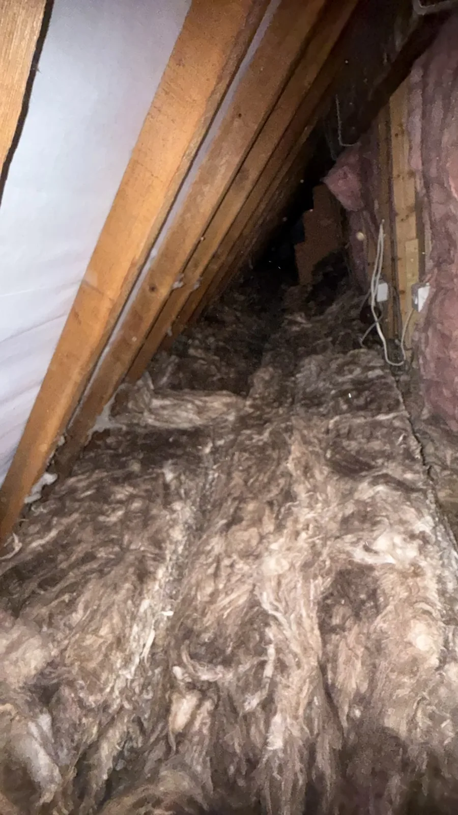Loft insulation worked into the eave area of a Heswall loft