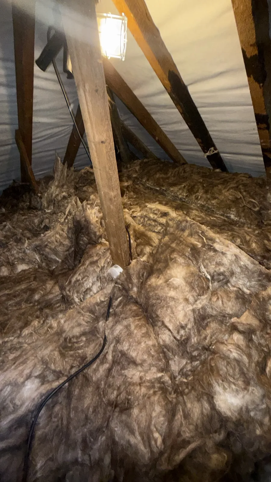 Heswall loft finished with mineral wool loft insulation across the floor under the rafters