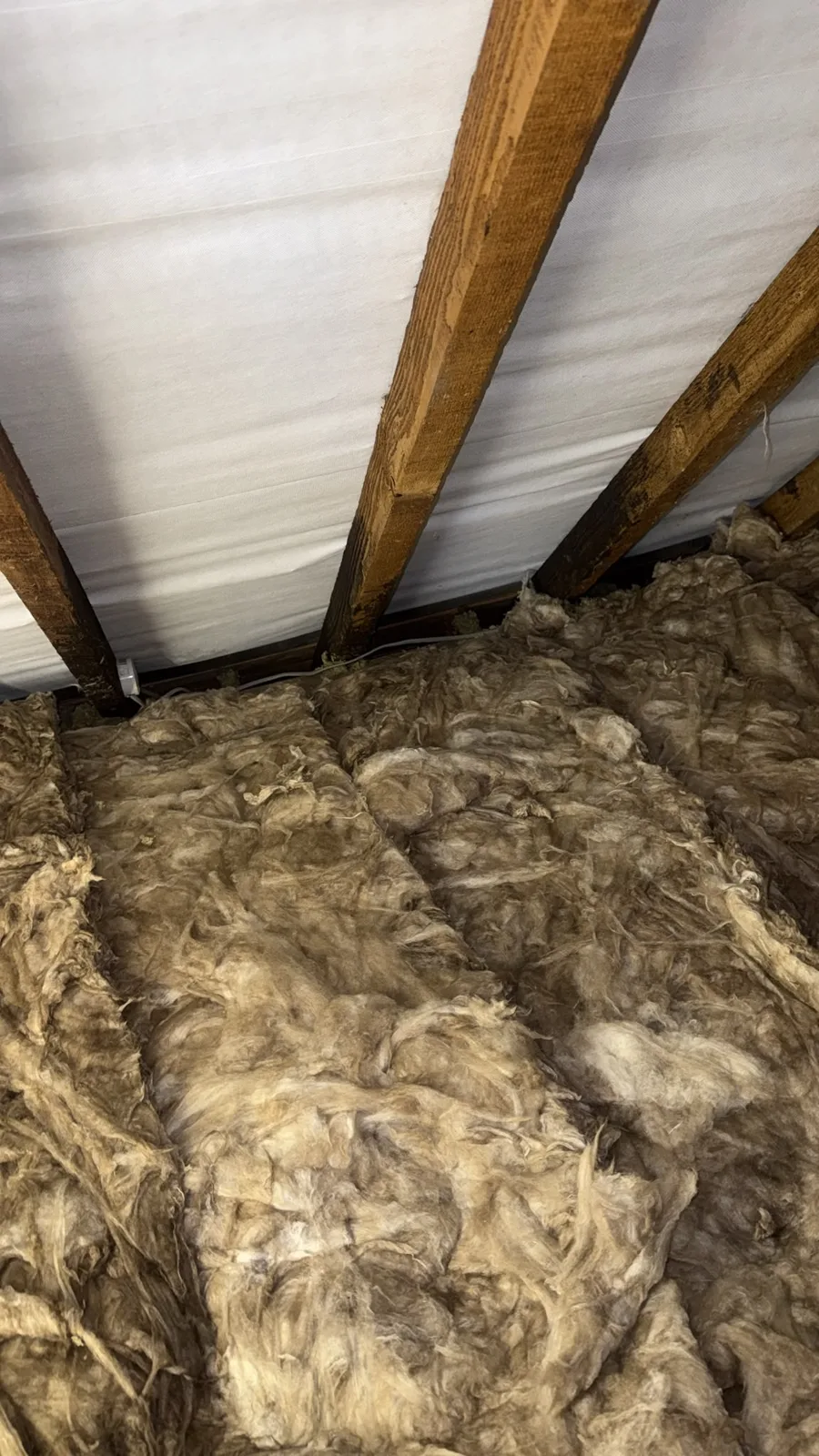 Mineral wool loft insulation laid between the rafters and the loft floor in Heswall