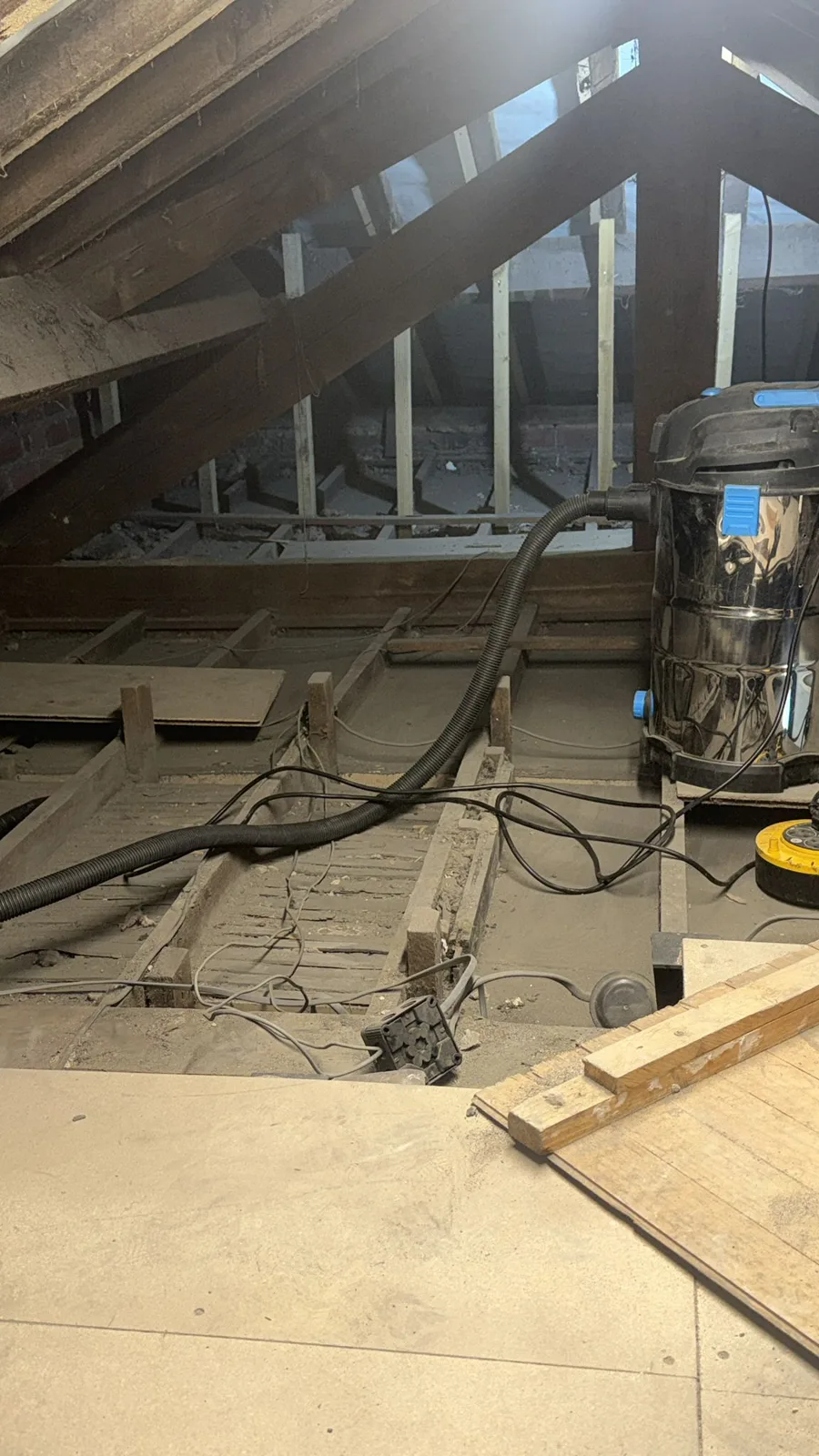 Huddersfield loft with old insulation removed and joists vacuumed before loft insulation
