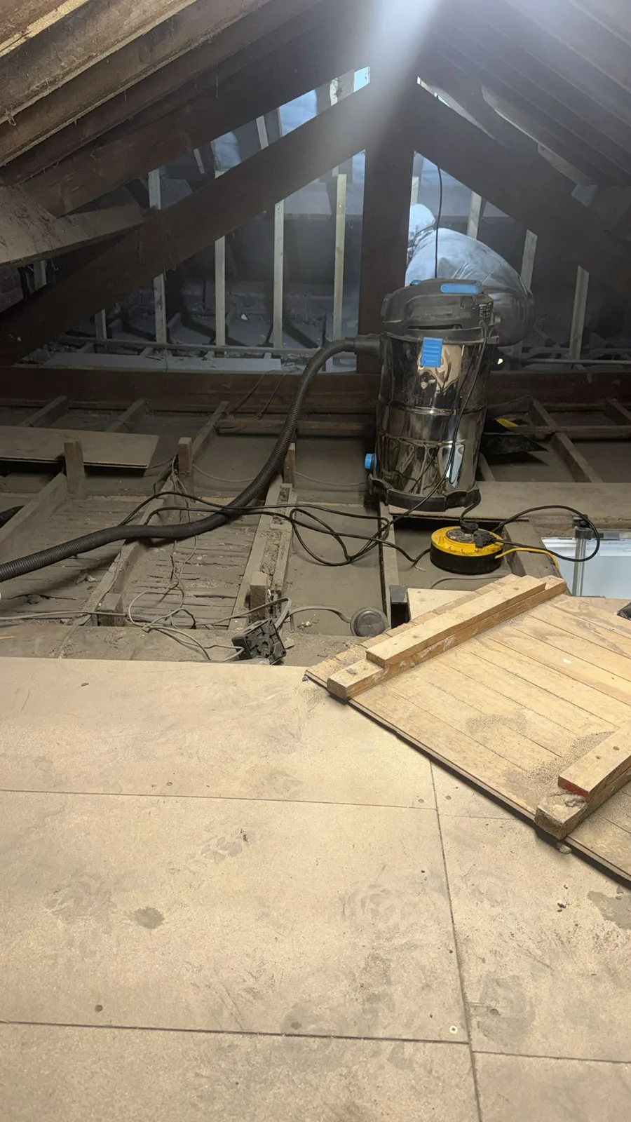 Existing raised loft boarding kept in place during loft insulation work in Huddersfield