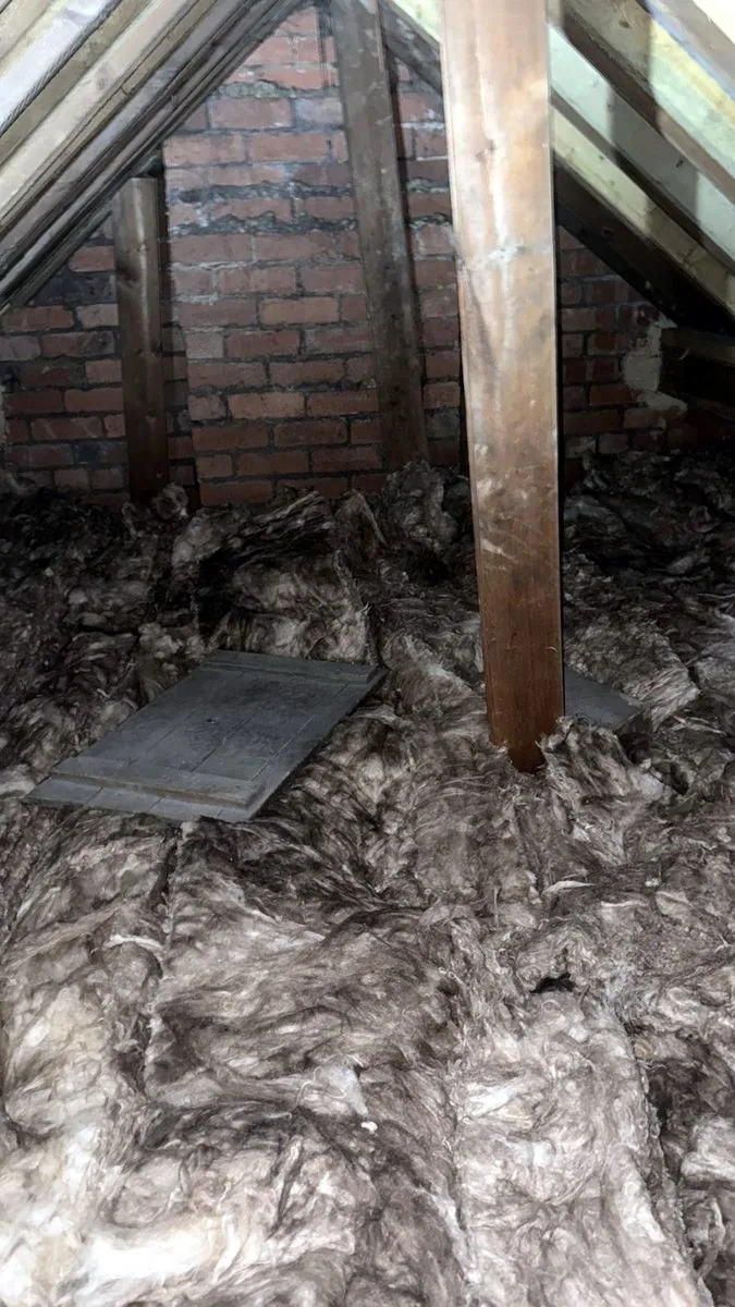 New mineral wool cross-laid over the joists in a Leeds loft