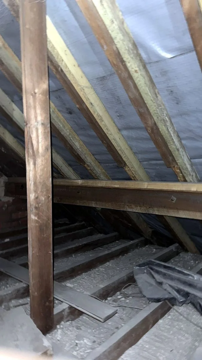 Leeds loft cleared back to bare joists before new insulation