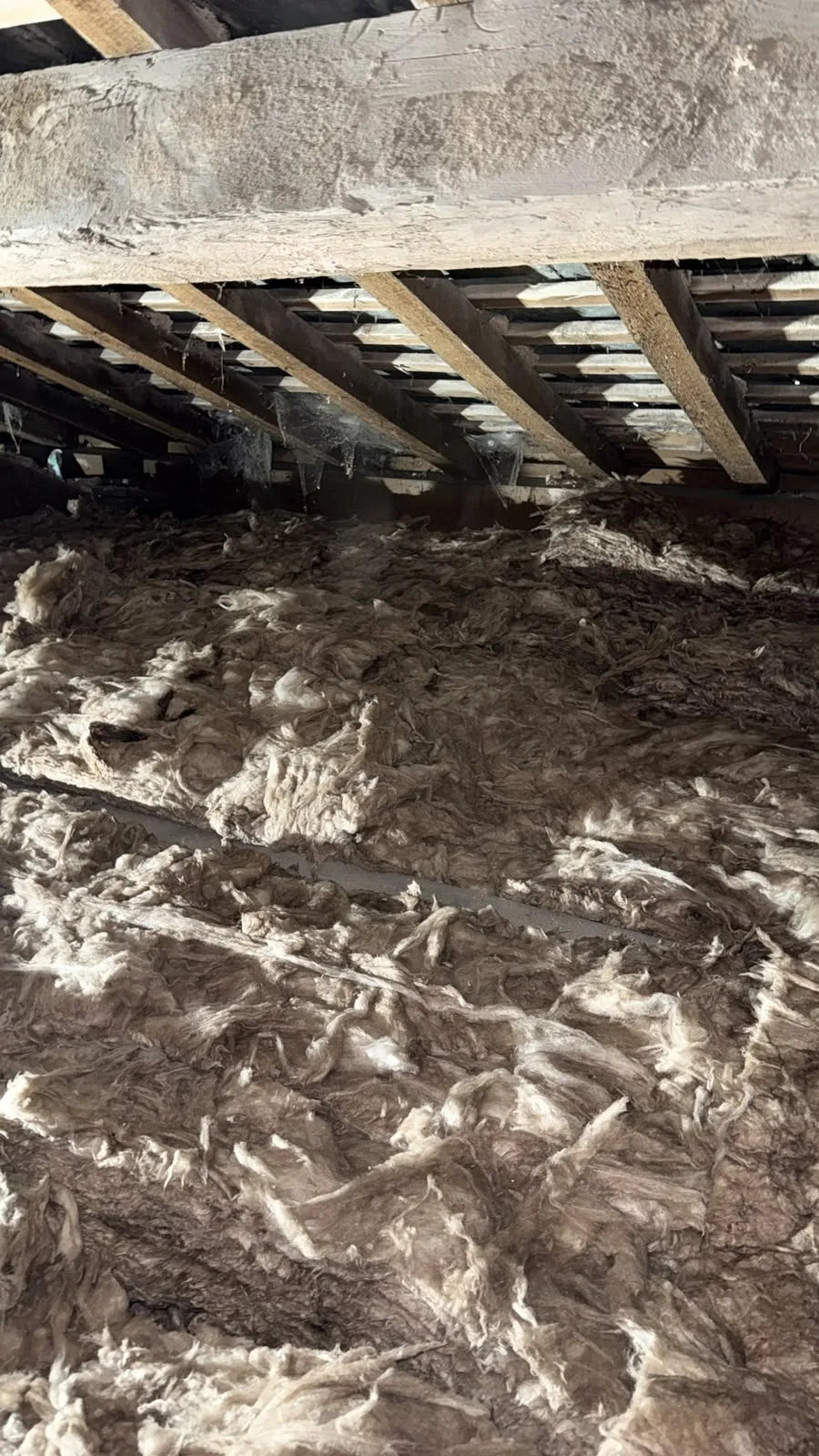 New Knauf mineral wool loft insulation laid to 300mm across a loft near Macclesfield