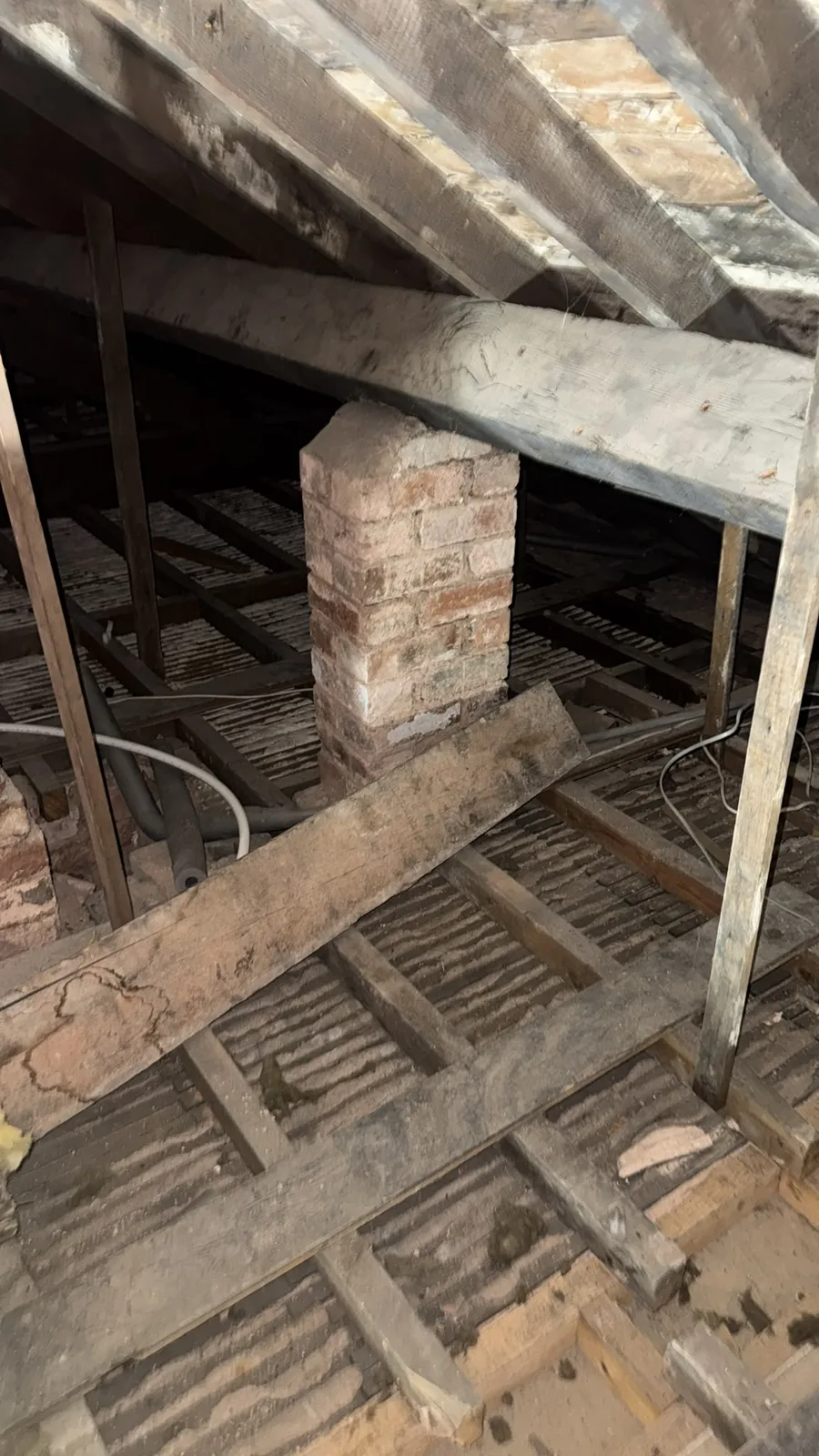 Macclesfield loft stripped back to the joists and ceiling after old loft insulation removal
