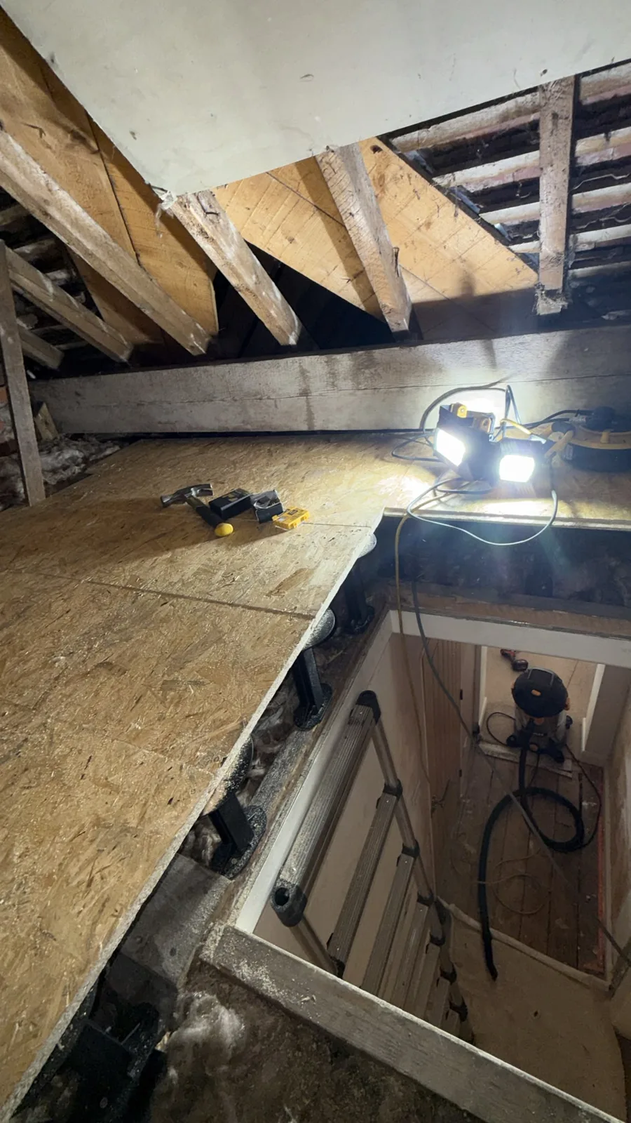 Loft boarding fitted next to the loft hatch for storage in Northwich