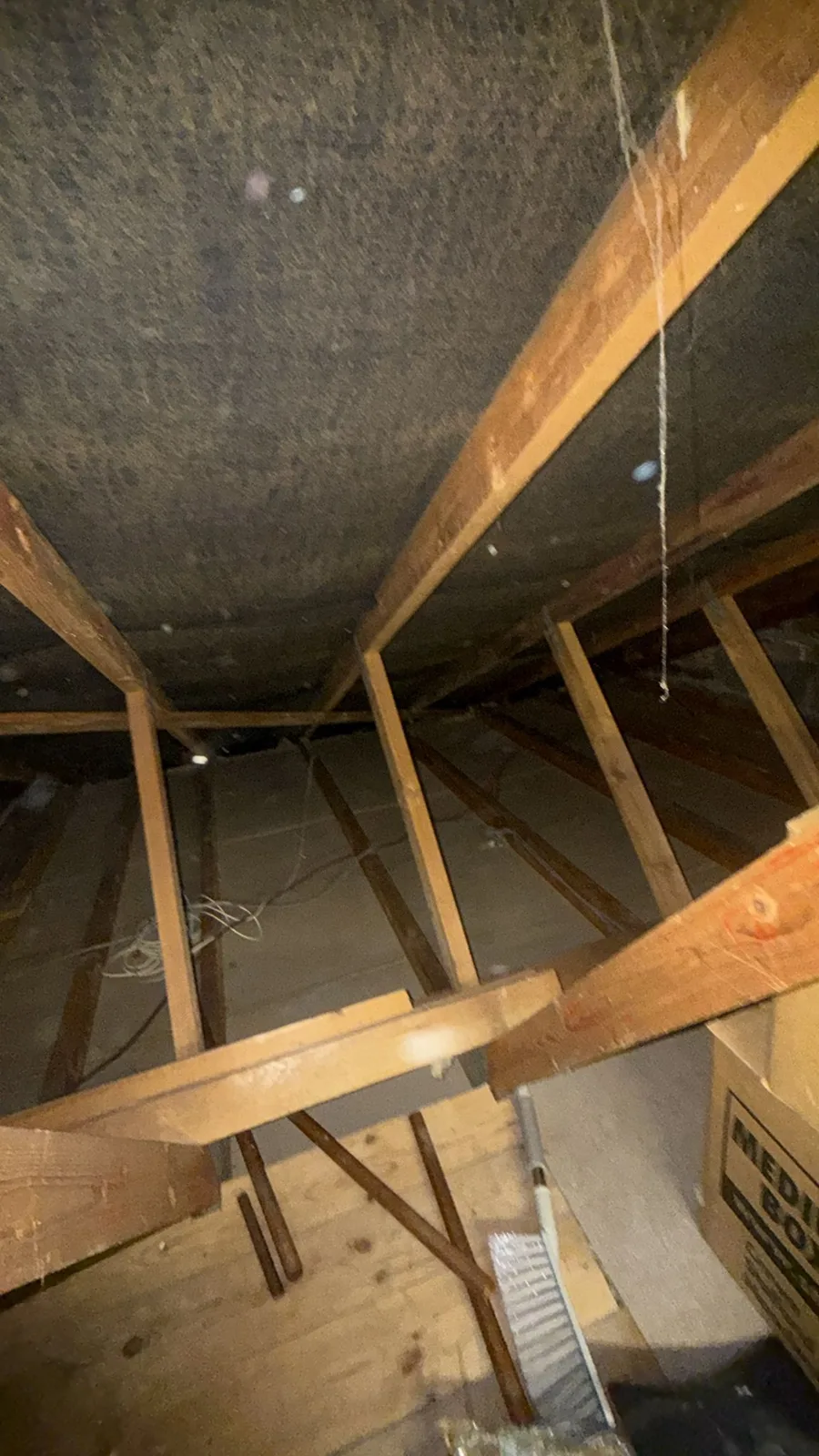 Clean joists in a Sandbach loft ready for new 300mm mineral wool loft insulation