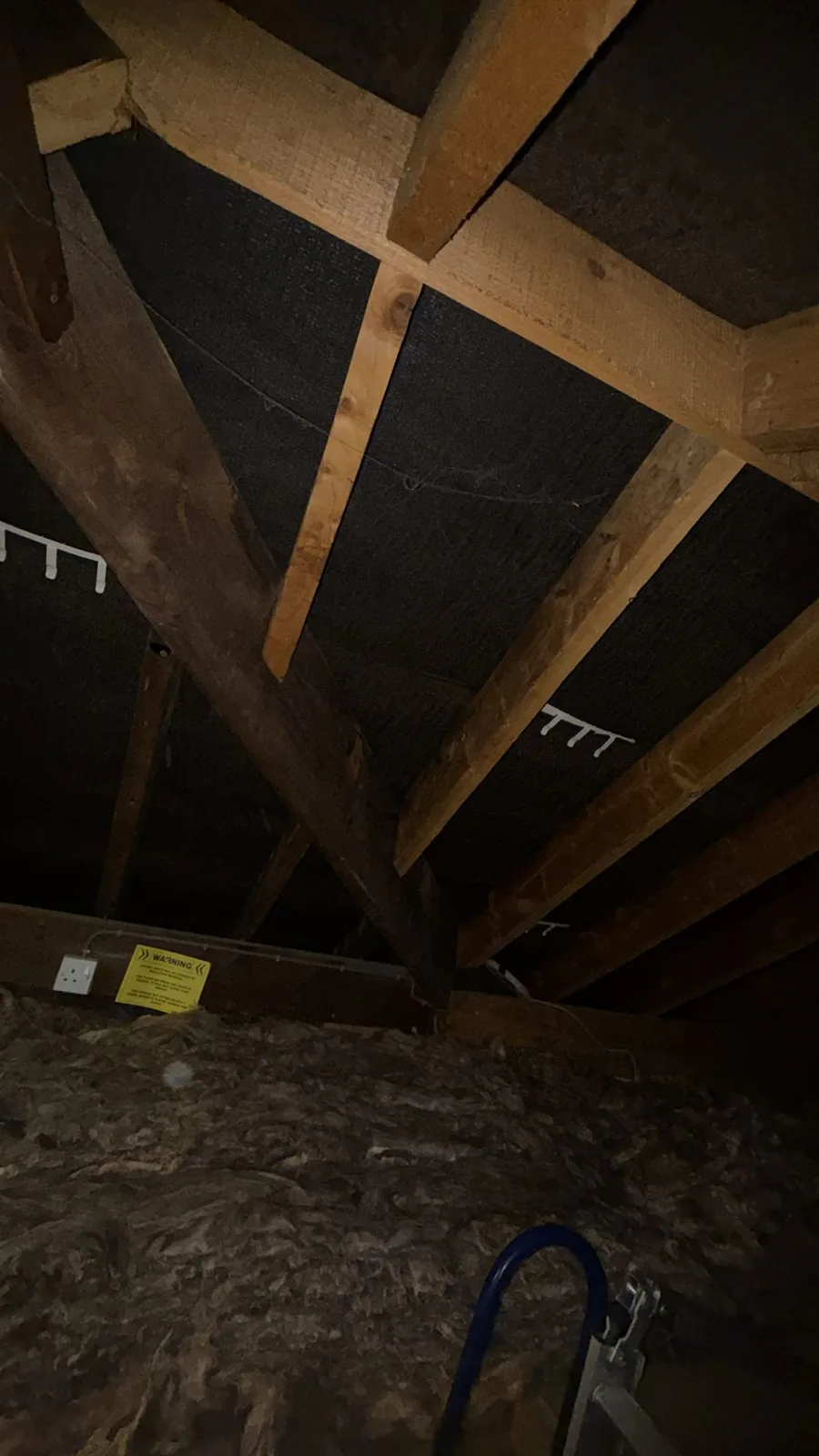Walsall loft later on the day of the loft insulation work, with mineral wool across the floor