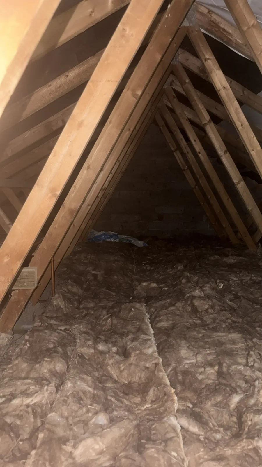 Finished Worcester loft with 300mm of mineral wool loft insulation across the joists