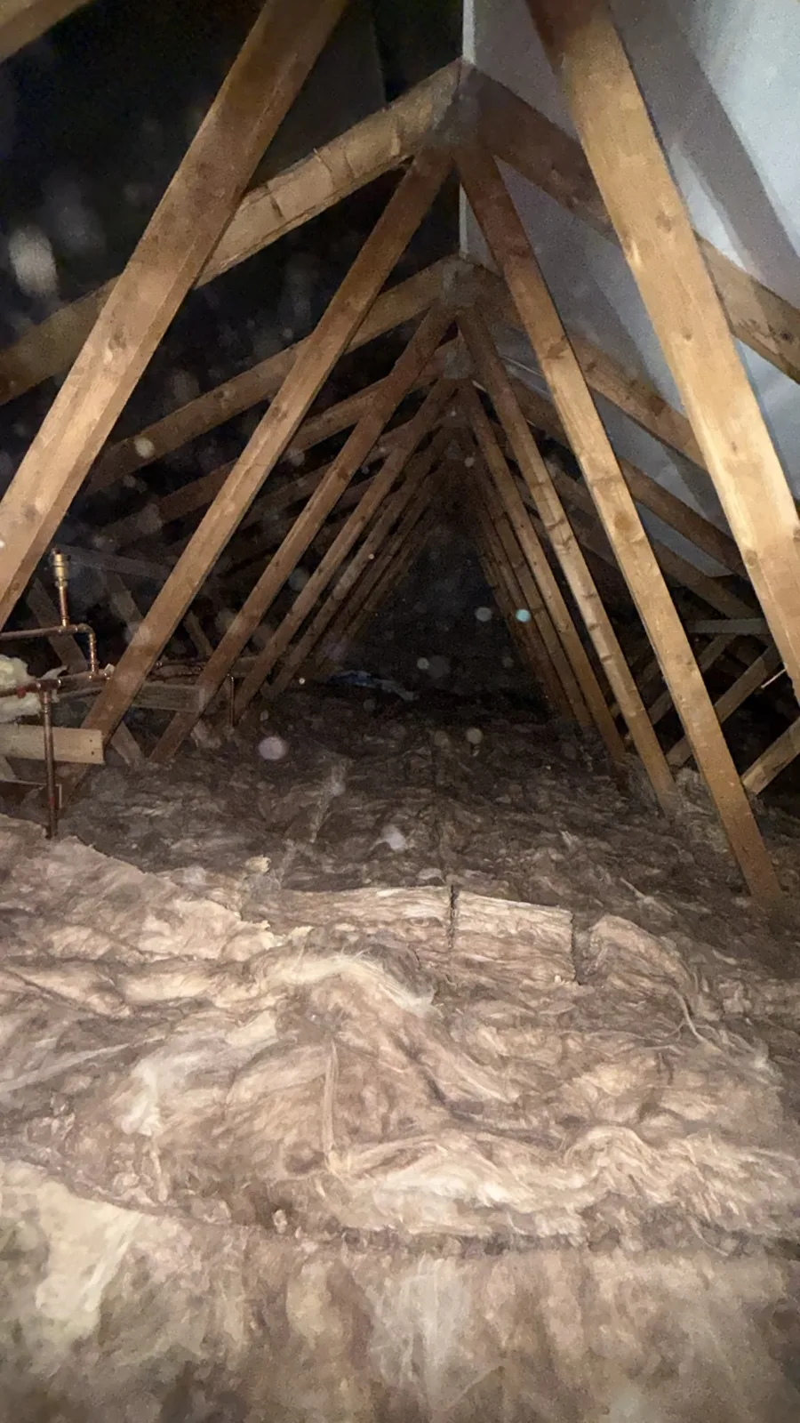 New mineral wool loft insulation laid along the length of a Worcester loft