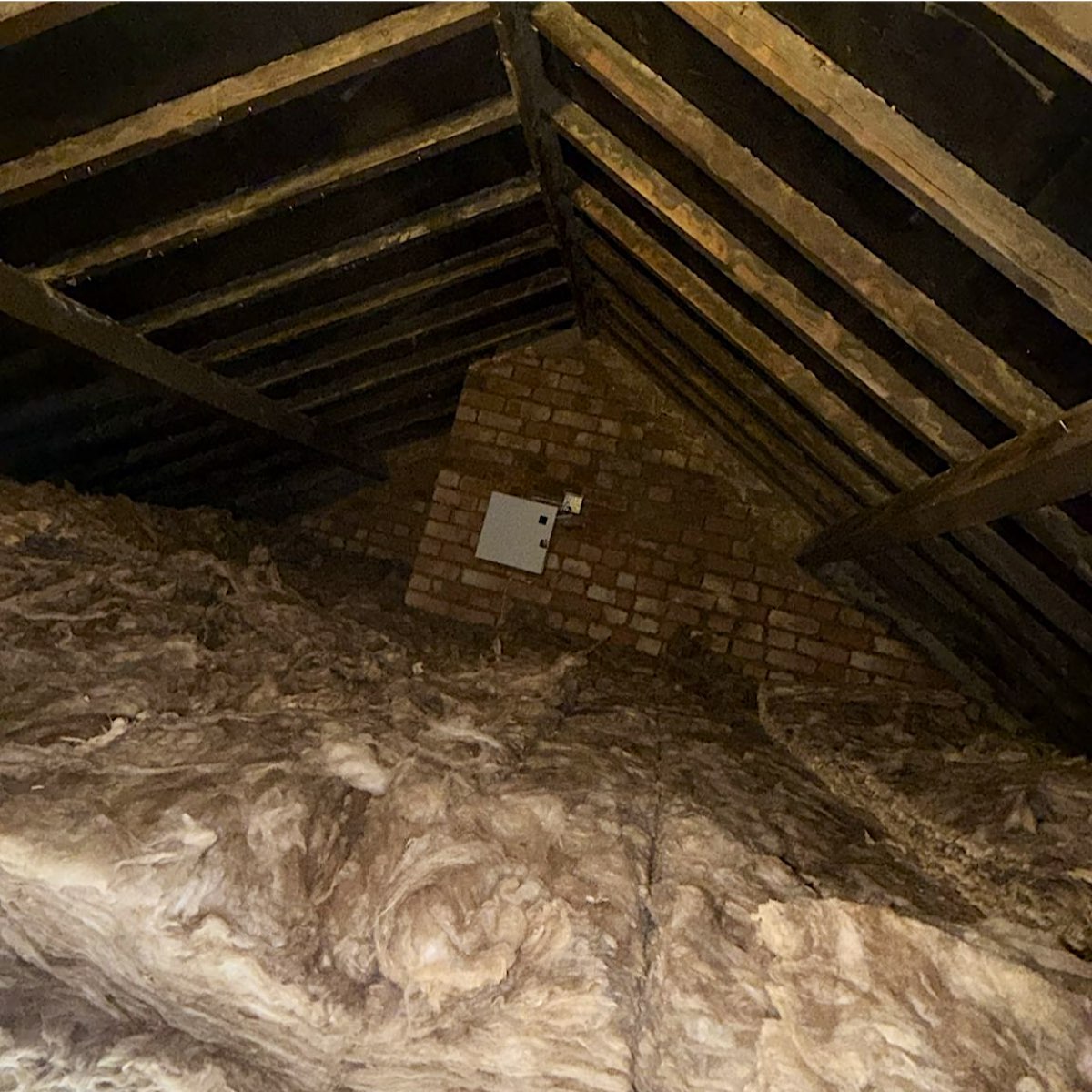 Birmingham loft after closed cell spray foam removal, with the rafters clear and new insulation laid