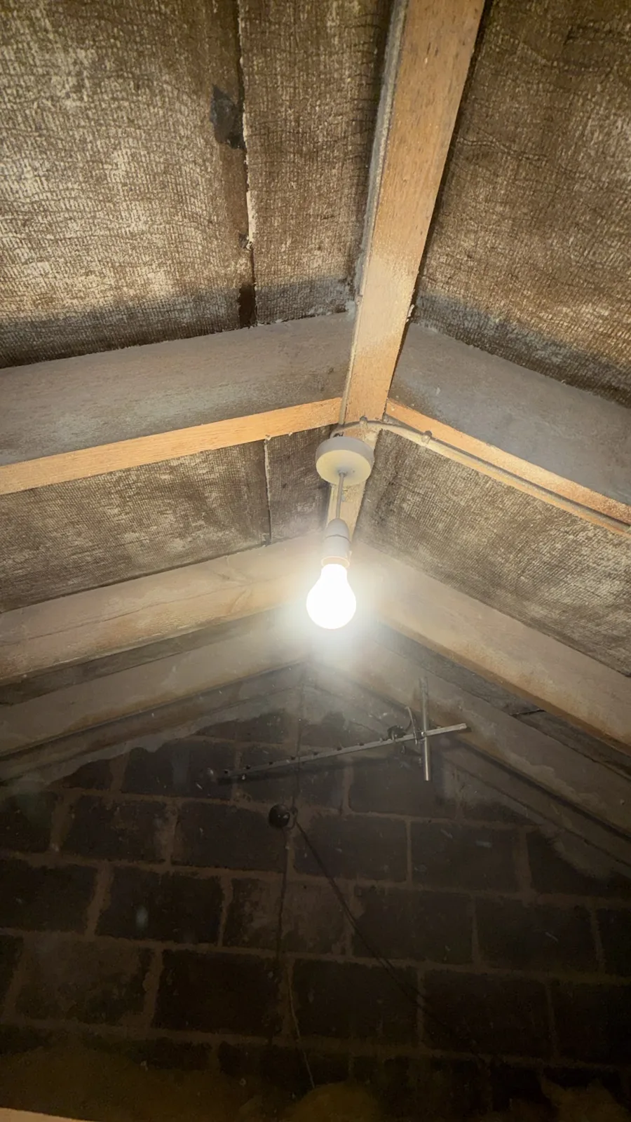 Rafters and gable wall cleared of open cell spray foam in a loft near Croston, Chorley