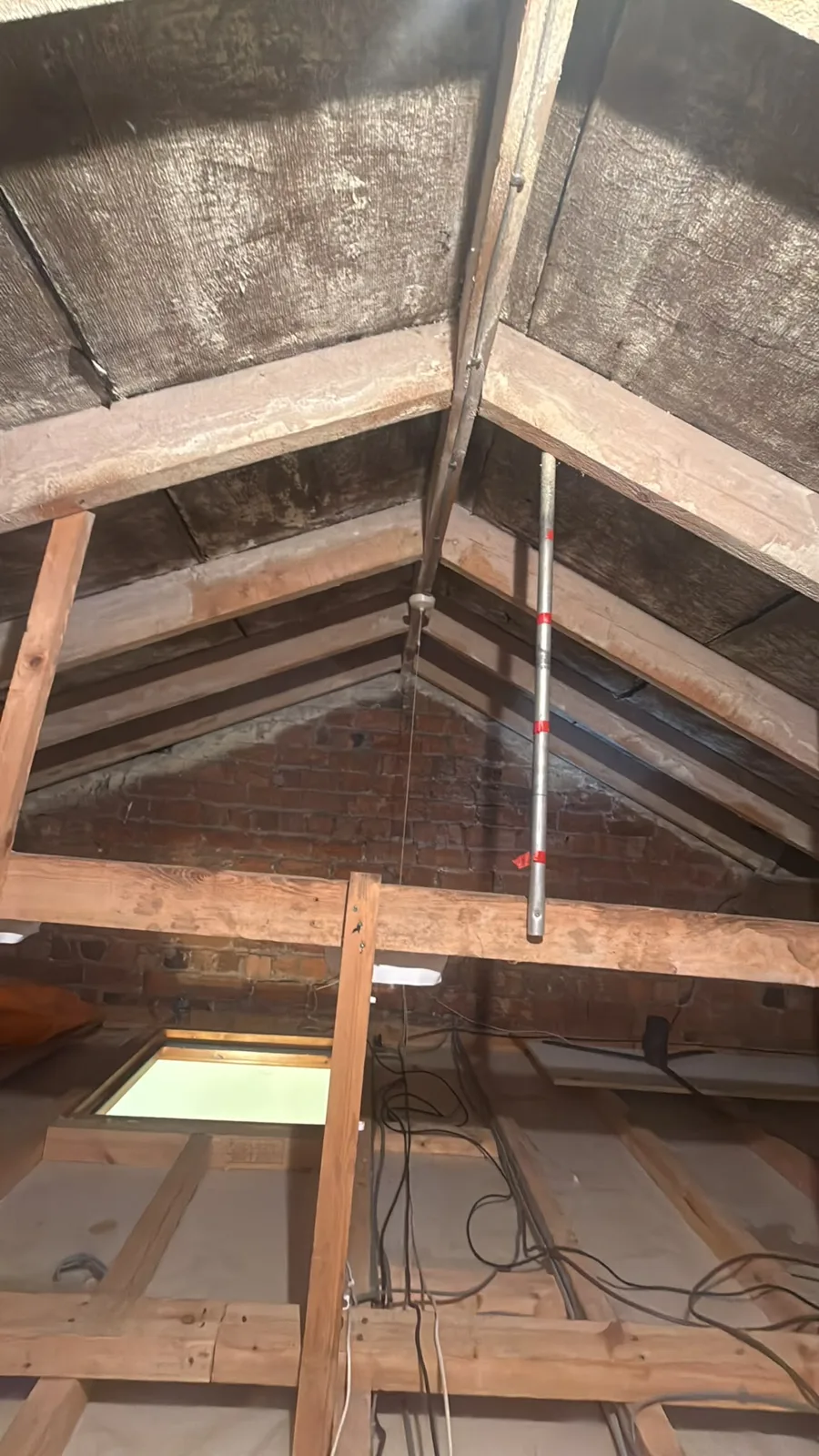 Main loft near Chorley after open cell spray foam removal, with rafters and felt cleared